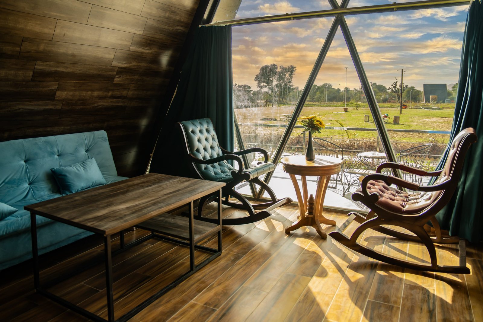 Luxury cottage interior with scenic countryside sunrise window view