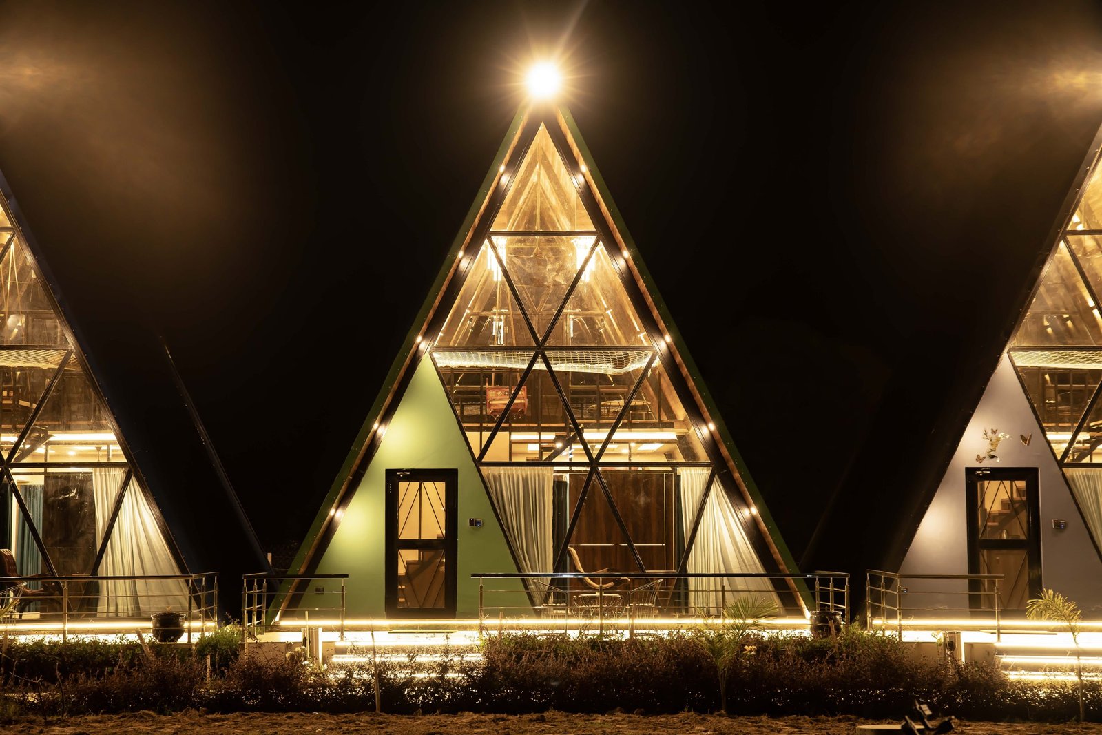 Signature A-Frame cottage at Sunflower Saga after dark